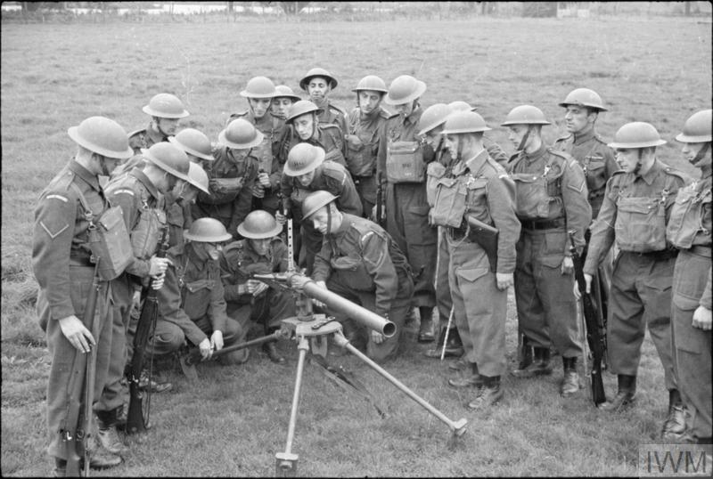 A group of Home Guard are trained in the use of a Northover Projector. © IWM